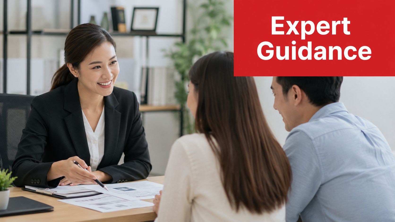 A professional advisor provides expert guidance to a couple during a meeting in an office setting.